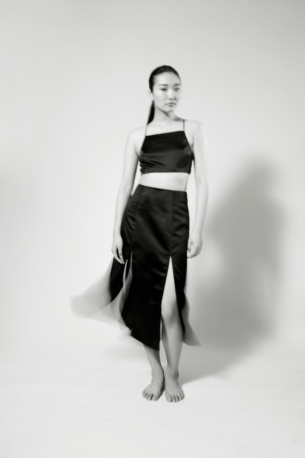 PRAE Luxury Lingerie Designer Silk Bralettes, About - Helene black silk bralette with Wells multi-slit skirt